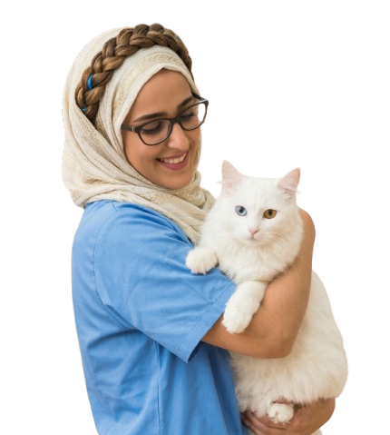 Veterinarian smiling while holding a white cat